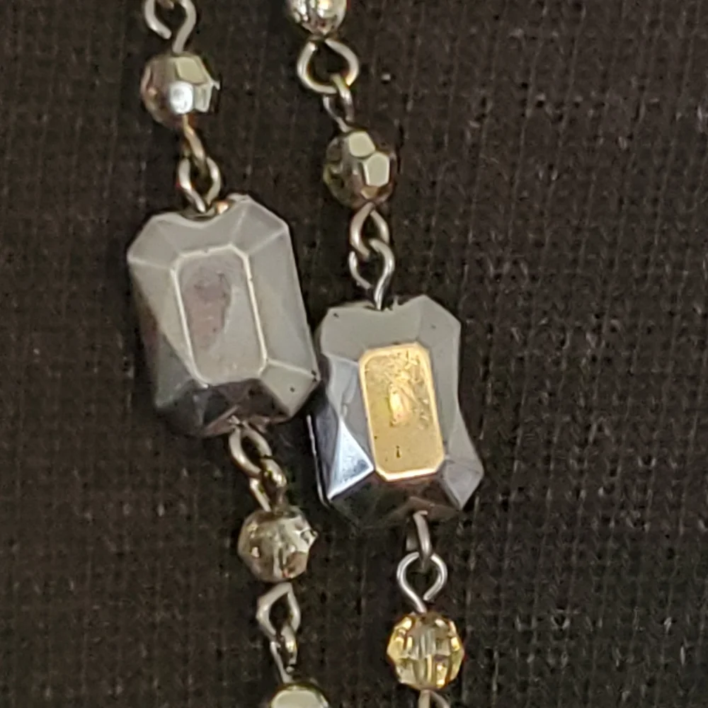 Silvertone and black bead and geometric stations necklace